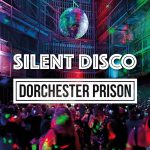 People dancing at a silent disco in Dorchester Prison